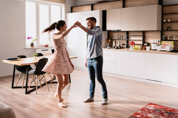 istock Man and woman dancing in a modern interior 1264662801