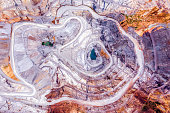 Top view of an open pit for the extraction of gold ore with depth of 250 meters