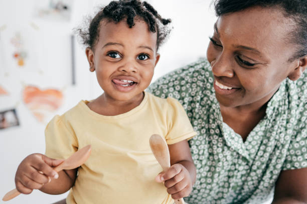 istock Adorable baby trying new meal plan , mom is smiling 1264665344