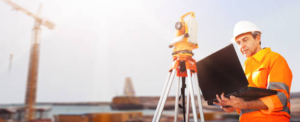 istock Senior land surveyor with theodelite 1264669776