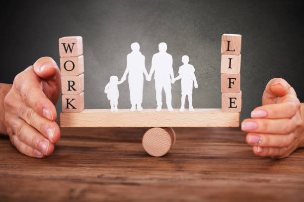 istock Human Figure Standing Between Work And Life Wooden Blocks 1264669808