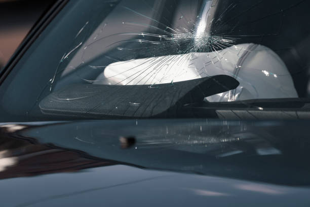 istock Cracked glass after car accident 1264669917