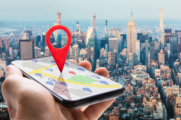 istock Human Hand Holding Cellphone With Navigation Sign 1264671225
