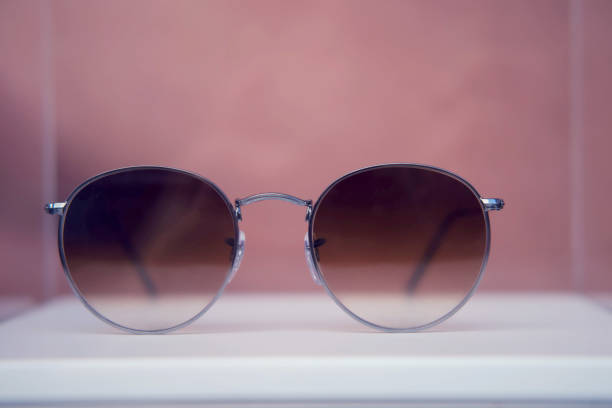istock Round sunglasses in silver metal frames close up on a store shelf 1264671370