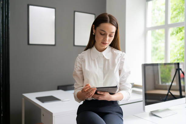 istock Young woman holding a digital tablet in the hands 1264673521