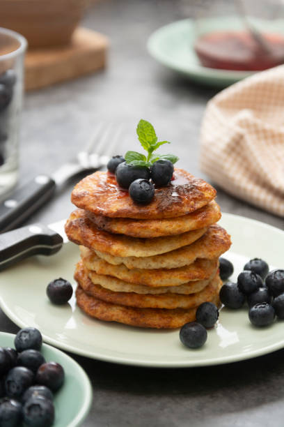 istock Pancakes stack with blueberries, healthy breakfast food, dark background. 1264674736