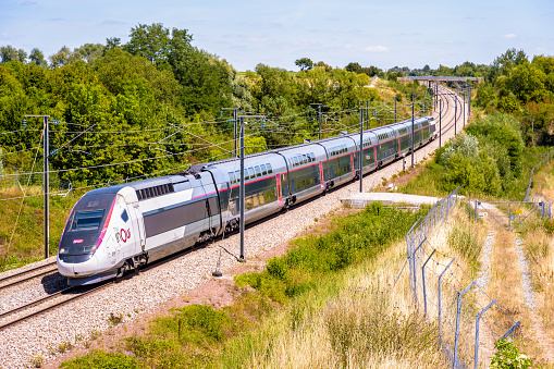 Ver-sur-Launette, France - July 29, 2020: A TGV Duplex inOui high speed train from french rail company SNCF is driving from Lille to Paris on the LGV Nord, the North European high speed railway line.