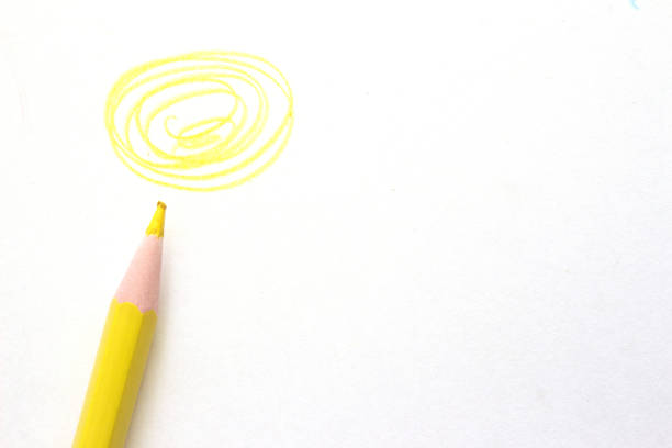 yellow pencil with streak on white paper with copy space