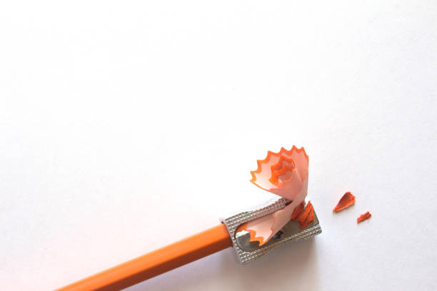 istock orange pencil with sharpener and sawdust 1264676682