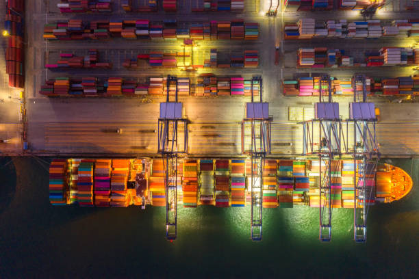 istock Container , container ship in export and import business and logistics. Shipping cargo to harbor by crane. Water transport International. Aerial view and top view 1264678807