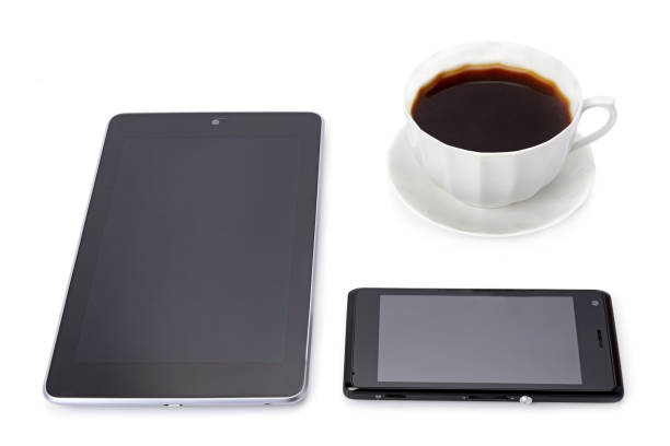 istock Smartphone, tablet and coffee cup isolated on white background. 1264679548