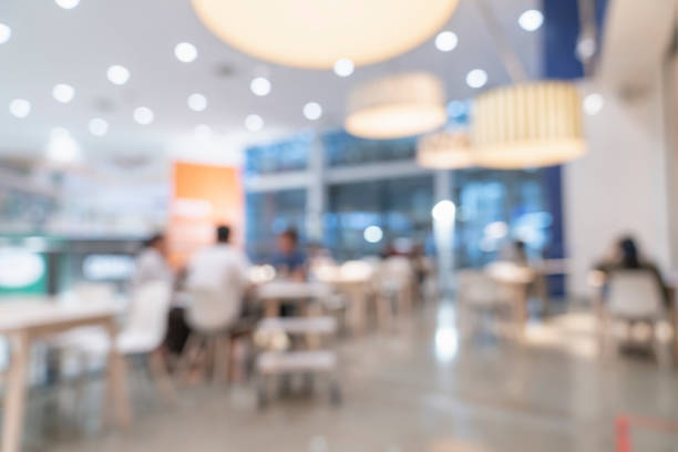 ショッピングモール百貨店の抽象的なぼかし画像の背景 - cafeteria ストックフォトと画像