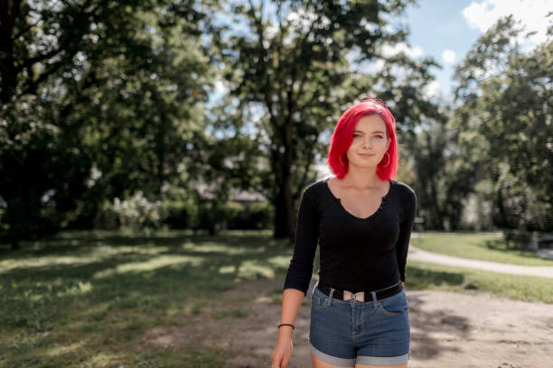 istock Dyed red hair young women 1264684085