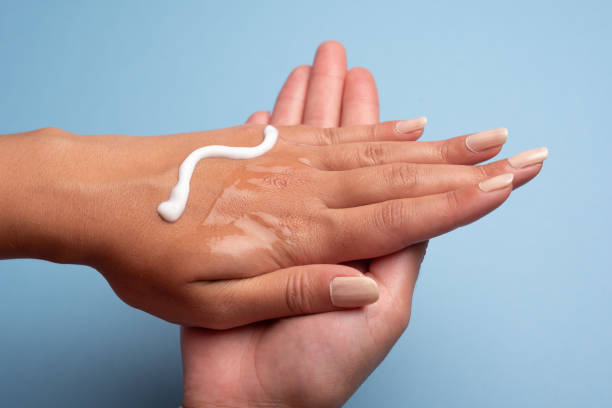 Moisturiser and hygienic gel advice. Hydrate and wash hands stock photo