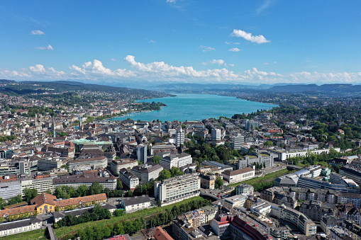 Zurich City with several office buildings and the beautiful lake zurich in the background. The image was captured during summer season.
