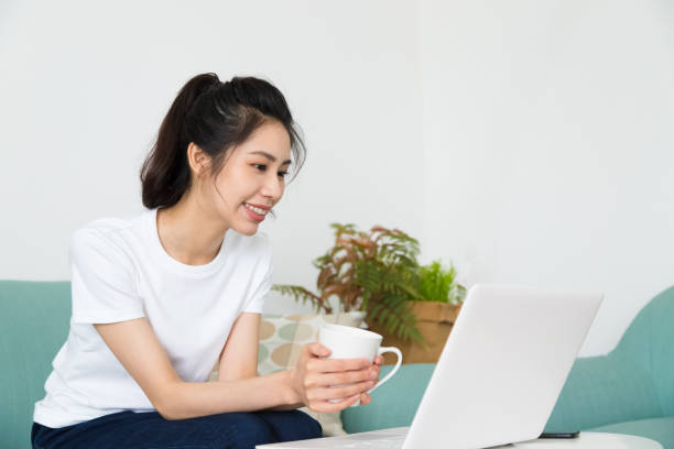 istock Beautiful freelancer female talking on video conference online with laptop at home. Study on online distant course. Talk on video call with friend or relative. 1264687395