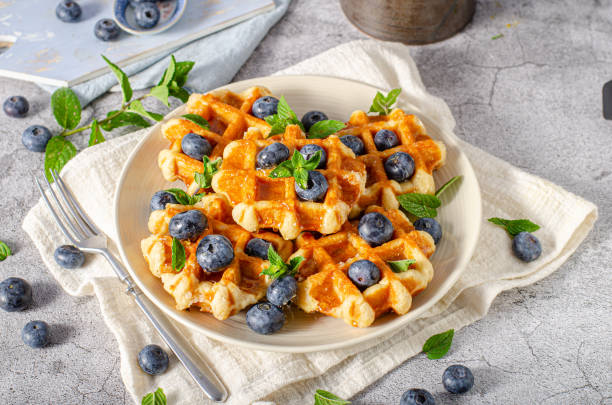 istock Homemade waffles with berries 1264687482