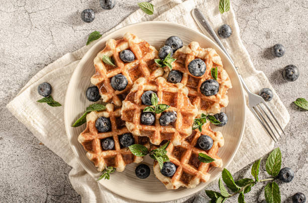 istock Homemade waffles with berries 1264687542