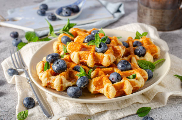 istock Homemade waffles with berries 1264687589