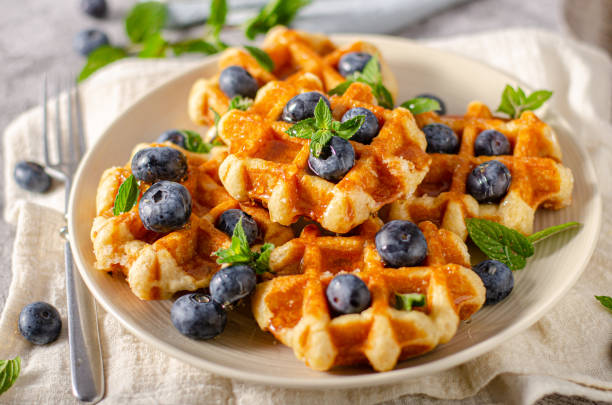 istock Homemade waffles with berries 1264687623