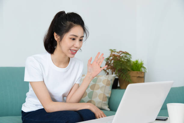 istock Beautiful freelancer female talking on video conference online with laptop at home. Study on online distant course. Talk on video call with friend or relative. 1264687663