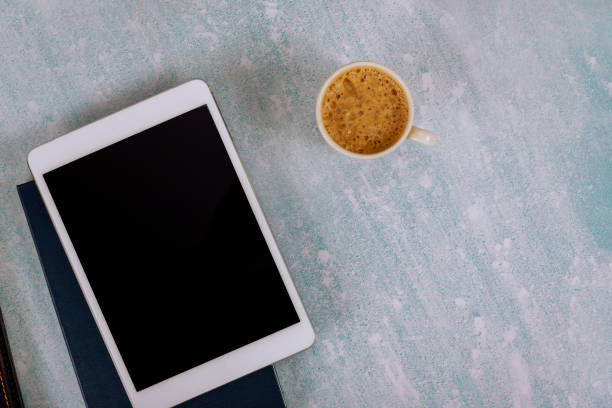 istock Working from home in day planning the week with a notebook weekly a cup of coffee. 1264690235