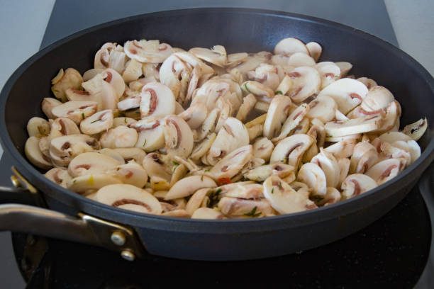 istock Champignon mushrooms are fried in a frying pan 1264693828