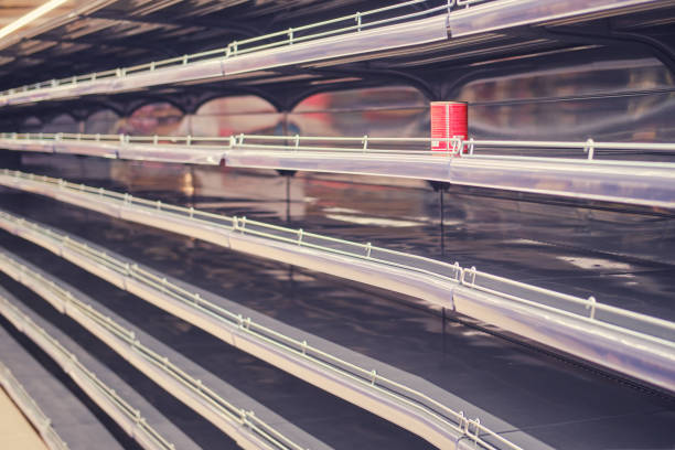 Store shelves without canned food during a rush of demand due to coronavirus Store shelves without canned food during a rush of demand due to coronavirus sold out photos stock pictures, royalty-free photos & images