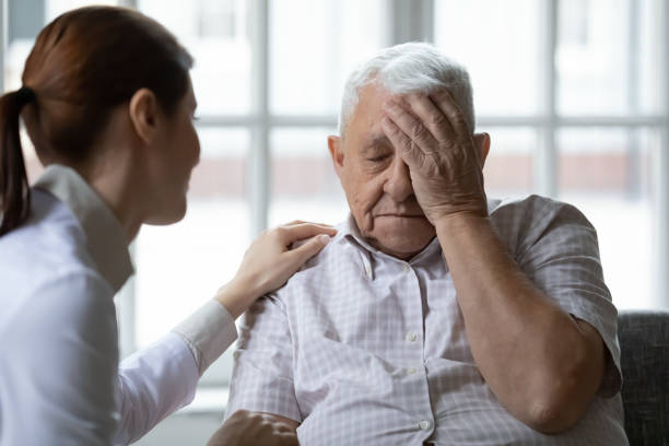 istock Female doctor comforting older man patient feeling unwell 1264699611