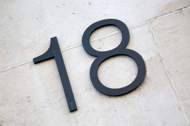 istock Eighteen Sign on Stone Wall 1264700702