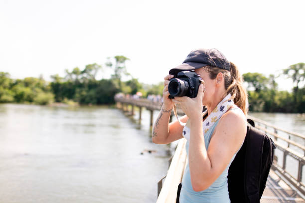 istock Tourist having fun in Iguazu falls 1264701513