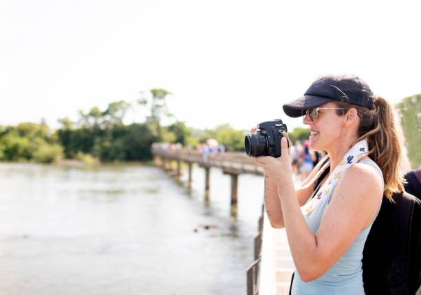 istock Tourist having fun in Iguazu falls 1264701541