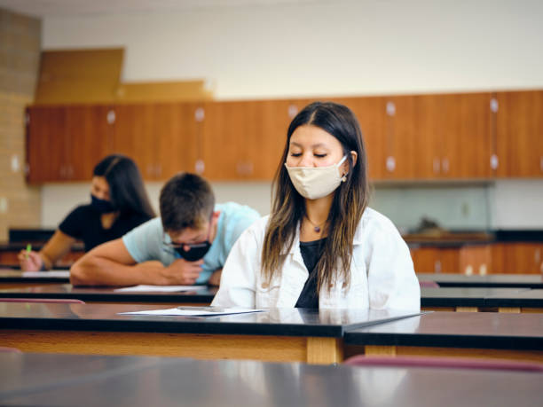 istock High School Students In Classroom Wearing Protective Face Mask 1264702994
