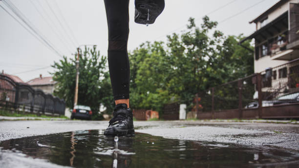 istock Close up of a leg in water while running 1264705432