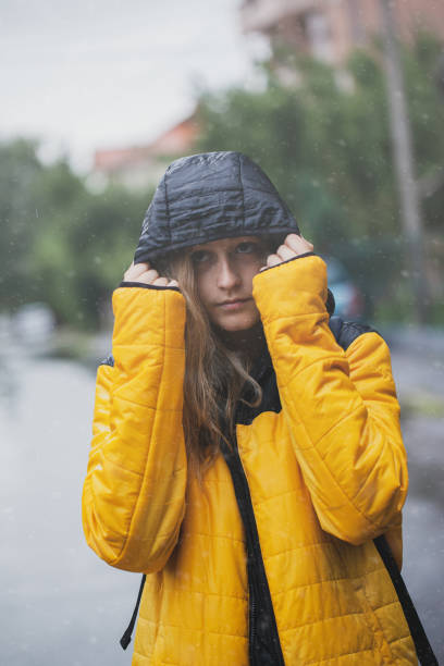istock Beautiful woman walking while snowing 1264707085