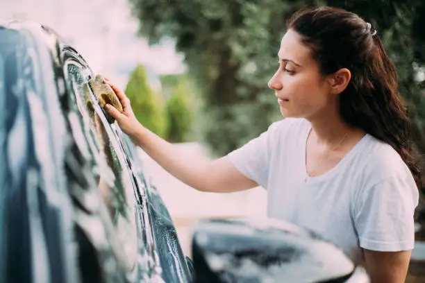 Photo of Woman washing her car