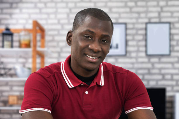 istock Young African Man Holding Digital Tablet 1264709813
