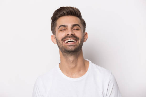 istock Close up portrait with loud laughing handsome bearded man. 1264711422