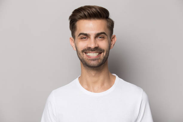 istock Close up portrait with smiling broadly handsome bearded man. 1264711428