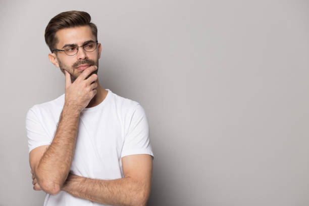 istock Close up portrait with suspicious handsome bearded man. 1264711431