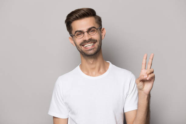 istock Close up portrait with handsome bearded man welcomes with gesture. 1264711435