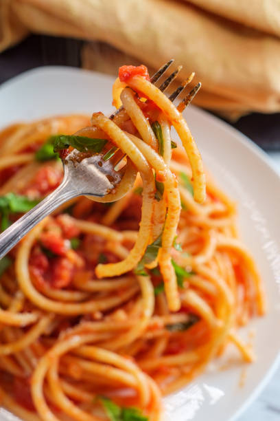 Bucatini All'Amatriciana - Wikipedia, the free encyclopedia Authentic Italian bucatini all'amatriciana made with san marzano tomatoes and garnished with fresh chopped basil and grated pecorino romano cheese all'amatriciana stock pictures, royalty-free photos & images