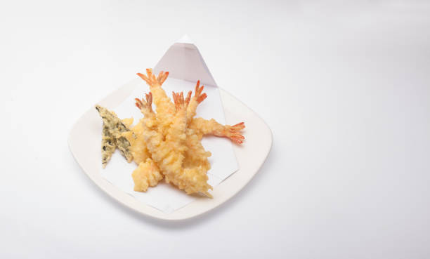 Ebi tempura served with white plant on white background. Ebi tempura served with white plant on white background. Tempura Prawns stock pictures, royalty-free photos & images