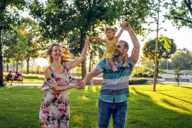 istock Happy family having fun in summer day 1264718512