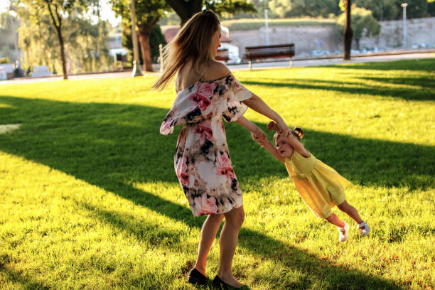istock Happy family playing in park summer days 1264718566