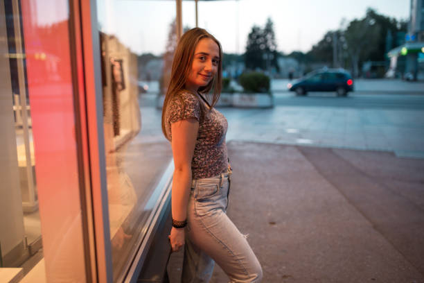 istock Young woman enjoying city at night 1264719603
