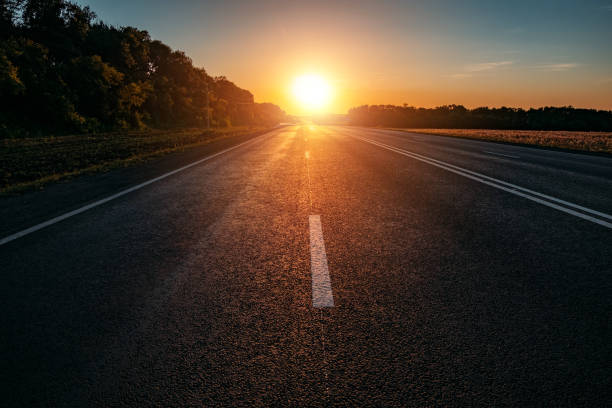 istock Evening sunlight above the asphalt road at the sunset 1264721041