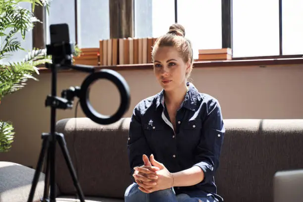 Photo of Confident psychologist is consulting online from home