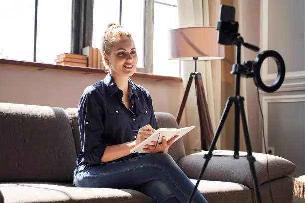 Photo of Smiling professional psychologist working online and looking confident