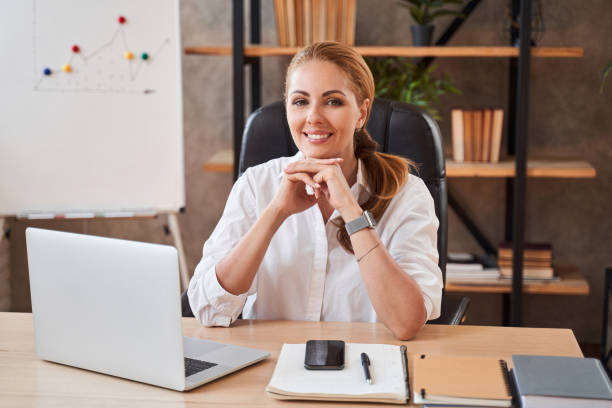 istock Calm lady enjoying her working day and smiling 1264721302
